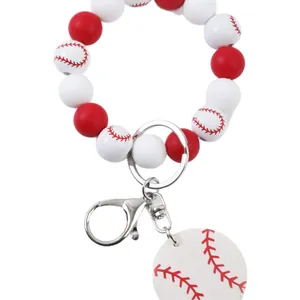 Pulsera llavero deportiva de cuentas de béisbol con perlas de silicona rojas y blancas.