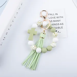Elegant sage green cross silicone beaded keychain with long tassel for bags and keys