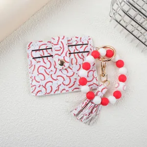 Detailed shot of baseball pattern card holder and silicone bead wristlet keychain