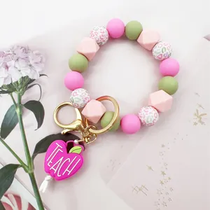 Colorful silicone beaded keychain bracelet with pink 'TEACH' apple charm for teacher gifts