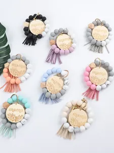 Colorful silicone and wood bead Mama keychains with stylish tassels and floral wood charms