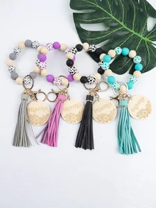 Handmade silicone beaded wristlet keychains with leather tassels and mama wooden charms