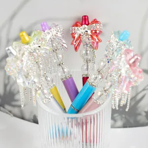 Colorful crystal beaded ballpoint pens featuring shiny rhinestone bow decorations