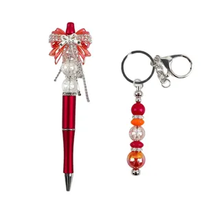 Red DIY beaded ballpoint pen and keychain set with crystal bow and sparkling rhinestones