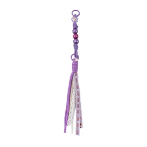 Handmade purple beaded tassel keychain with acrylic beads and floral fabric strips