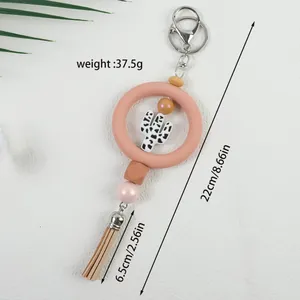 Llavero boho de cuentas de silicona con cactus, borla y especificaciones de dimensiones