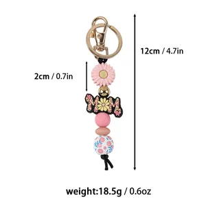 Detail view showing dimensions and weight of floral silicone bead keychain with MOM charm