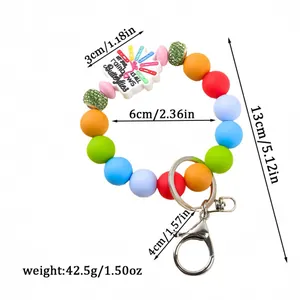 Colorful silicone bead keychain with rainbows and butterflies charm and metal clip