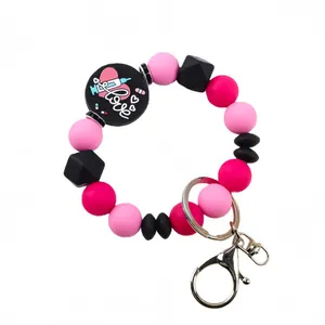 Cute pink and black silicone beaded keychain with Love heart and medical syringe charm