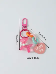 Detailed view of colorful balloon dog keychain with rainbow chain and heart charm