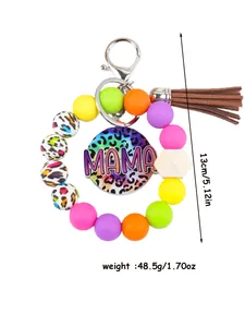 Detail view of colorful silicone bead MAMA bracelet keychain with size and weight info.