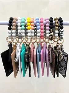 Collection of colorful silicone bead wristlet keychains with PU card holders and tassels