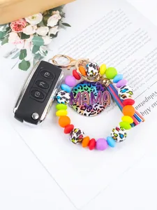 Colorful silicone beaded wristlet keychain featuring leopard MAMA charm and tassel detail