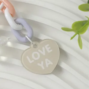 Colorful acrylic link chain keychain featuring a beige 'LOVE YA' heart pendant ornament