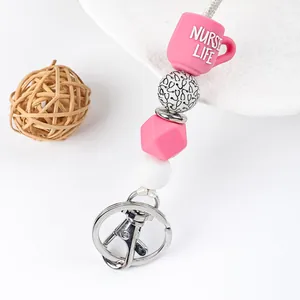 Close-up of silicone beaded lanyard with 'NURSE LIFE' mug and stethoscope pattern beads