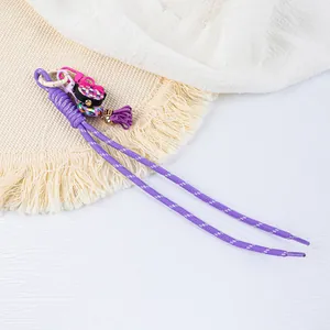 Handmade purple braided rope keychain with colorful silicone charms and tassel detail