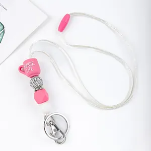 Close-up detail of pink Nurse Life cup silicone bead lanyard with durable metal clasp.