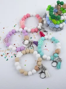 Detailed view of handmade silicone bead keychain bracelets with tassels