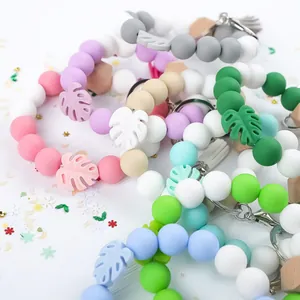 Colorful handmade silicone beaded bracelet keychain with monstera leaf charm pendant
