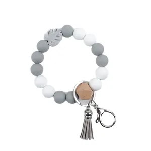 Silicone beaded tassel keychain bracelet with wooden bead and leaf charm for bag decor
