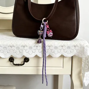 Handmade silicone bag charms set with purple rope and heart pendants