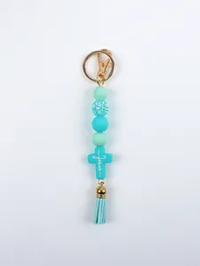 Blue silicone bead keychain featuring a Jesus cross pendant and matching leather tassel charm