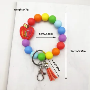Rainbow silicone beaded wristlet keychain with apple TEACH charm and orange tassel