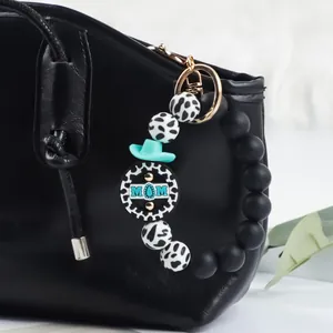 Portachiavi a bracciale con perline di silicone, motivo mucca e ciondolo MOM su borsa