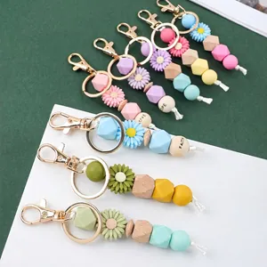 Mignon Porte-clés Perlé en Silicone Pendentif Marguerite Mode Perles en Bois avec Lettres Anneau de Clé Gland Charme de Sac pour Femmes Filles Cadeau