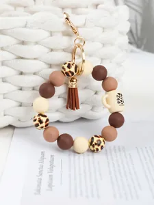 Leopard print silicone bead wristlet keychain with a mini cup charm and tassel