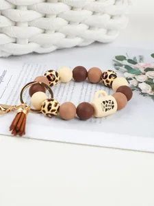 Leopard print silicone beaded keychain with coffee mug charm and brown leather tassel