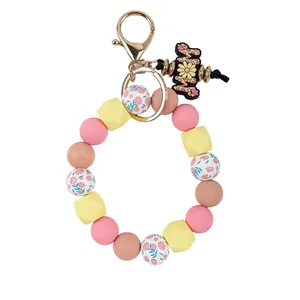 Floral silicone beaded wristlet keychain with octagonal beads and decorative Mom charm