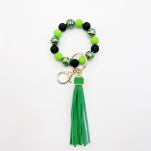 Detailed view of neon green and black beaded wristlet keychain with zebra pattern