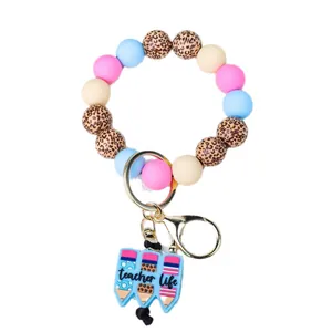 Porte-clés bracelet perlé avec motif léopard et breloque crayon de vie de prof