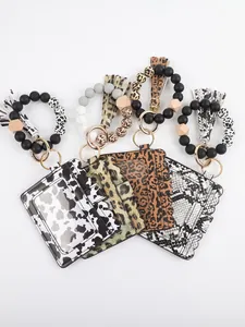 Collection of silicone bead wristlet keychains with animal print PU card holders