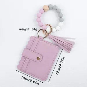 Bead bracelet keychain with purple PU leather card holder and tassel detail