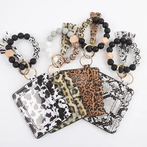 Set of beaded bracelet keychain card holders with tassels in stylish animal print patterns