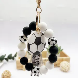 Pulsera llavero cuentas de silicona fútbol con dije de madera y borla elegante