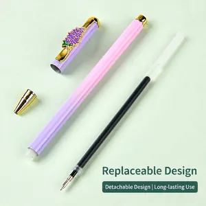 High-end metal ballpoint pen set with floral cap and refillable black ink.