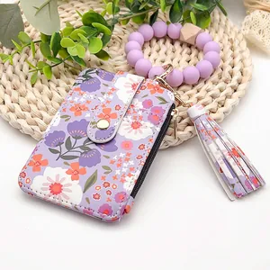 Florale PU-Leder-Kartenhülle mit violettem Silikon-Armband und Quasten-Schlüsselanhänger