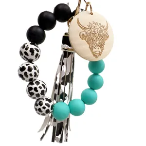 Western style cow print silicone bead keychain with highland cow wood disc