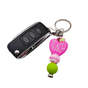 Teacher's silicone apple beaded keychain with pink rhinestone and green bead for bags