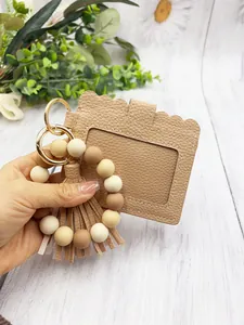 Detailed view of khaki silicone bead bracelet card holder with matching PU leather tassel