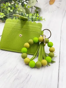 Stylish green PU leather card holder set with silicone bead bracelet and tassel keychain
