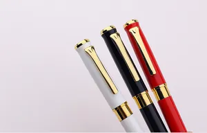 Close-up of elegant business metal pens in white, black, red with gold accents