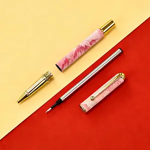 Metal gel pen with pink gradient mountain pattern disassembled on yellow-red background