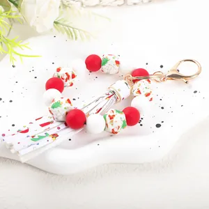 Close-up of 14mm silicone beads and festive tassel on Christmas wristlet keychain
