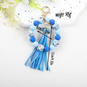 Detailed measurements of a blue silicone bead bracelet keychain with a long tassel.