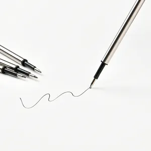 High-quality metal ballpoint pen refills with black ink shown writing smoothly