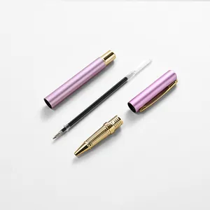 Premium metallic rollerball pen disassembled showing pink barrel and gold components
